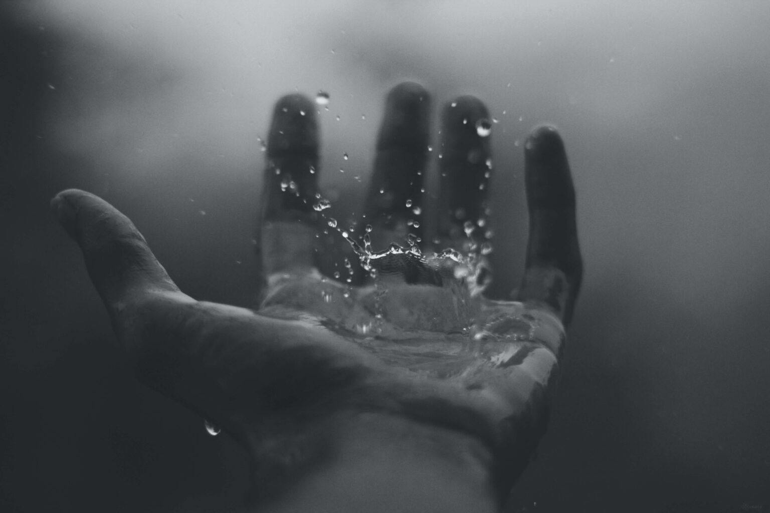 Water falling into an open hand